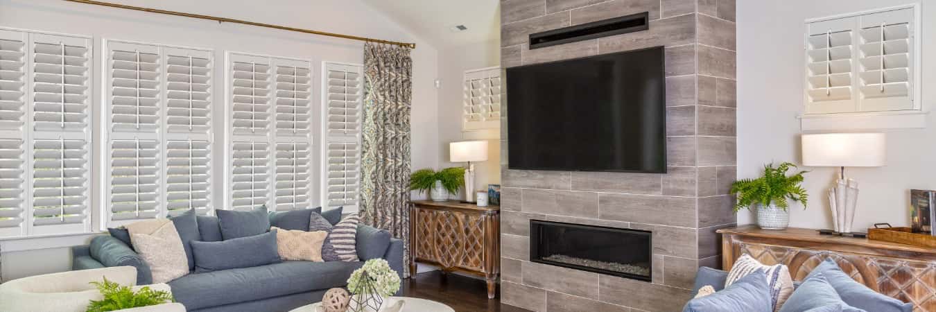 Interior shutters in Newport News living room with fireplace